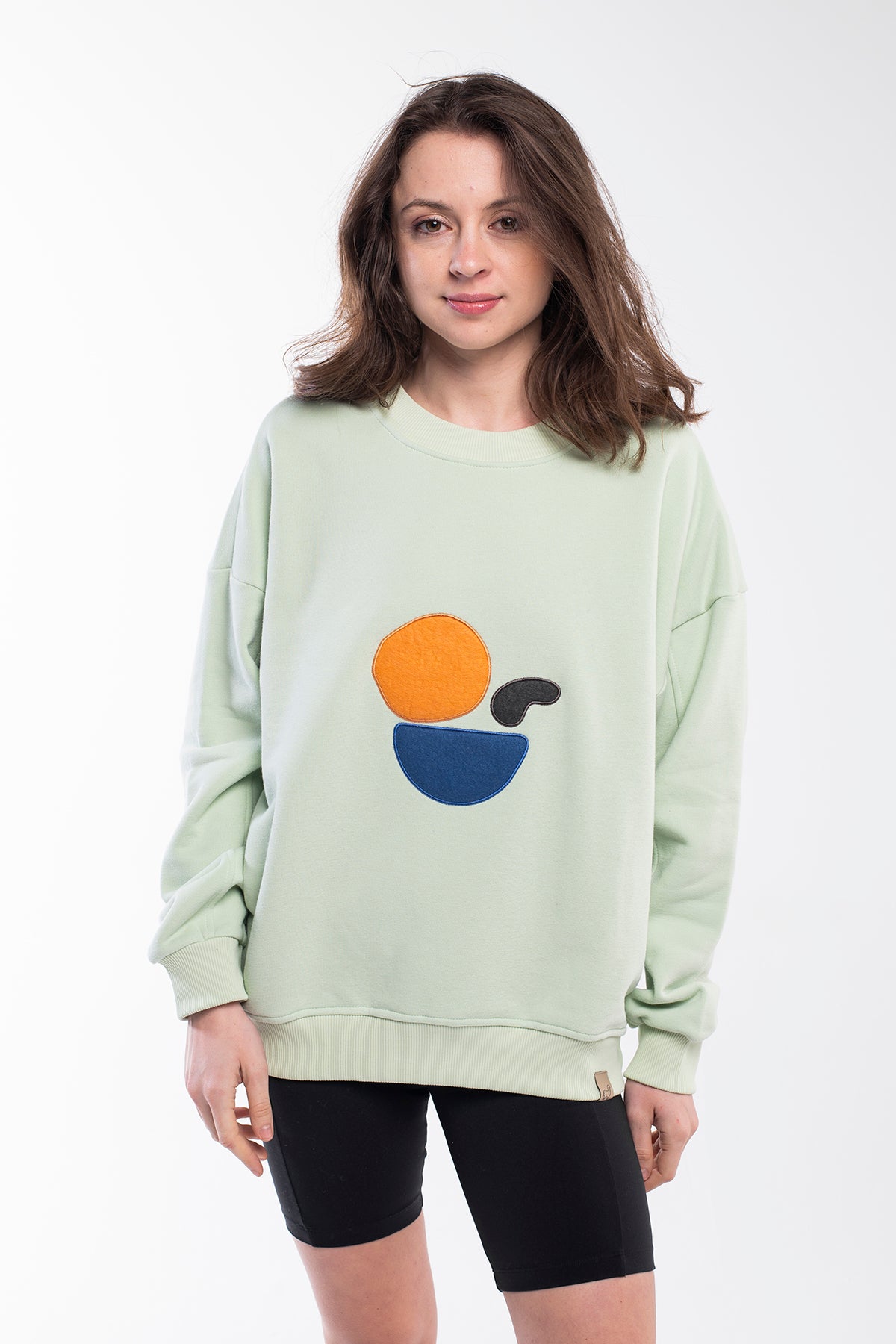 Pastel mint green balance stones sweatshirt witha round neck