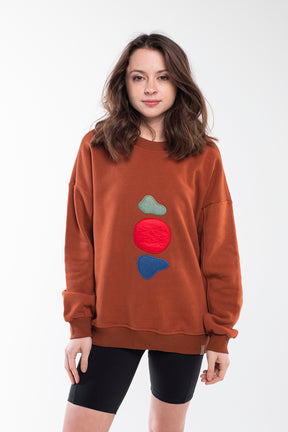 Red brown balance stones sweatshirt with a round neck