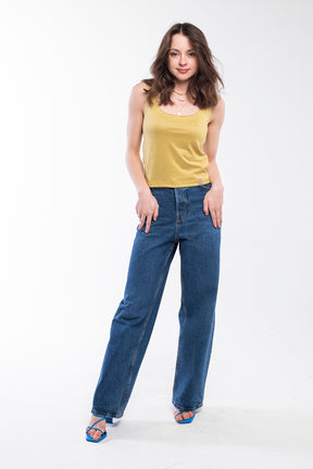 This top features a cropped length and a soft, knitted material in golden yellow.