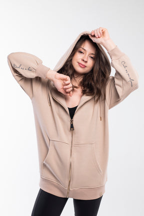 Thermal hoodie with drop shoulder, drawstring and golden zipper in light brown.