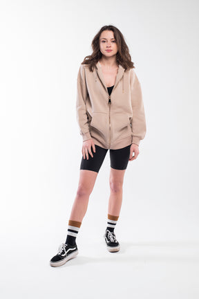 Oversize zip up hoodie in light brown with golden zipper.