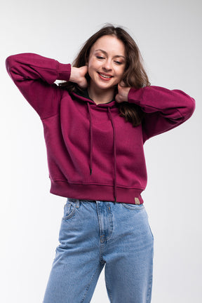 Soft-feeling cozy cropped hoodie in fuchsia purple.