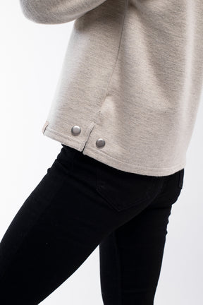 Cozy high neck buttoned pullover for women in beige white with side buttons..