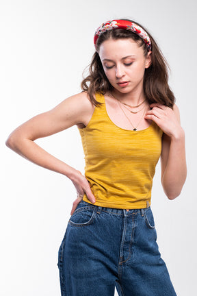 Mustard yellow soft-feeling knit top for women.