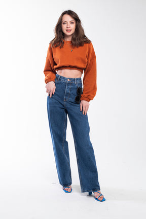 Tiger orange fresh crop top sweatshirt with a round neck and an elastic waistband.