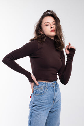 Dark brown sweater with a high collar and long sleeves. It is light and pleasant to the touch.